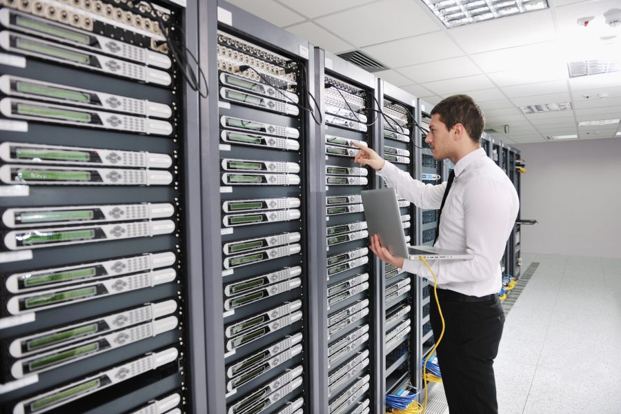 young handsome business man  engeneer in datacenter server room